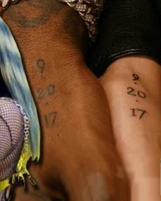 Cardi B and her husband, Offset ink each other with a tattoo gun and get matching tattoos of their wedding date on their hands!
